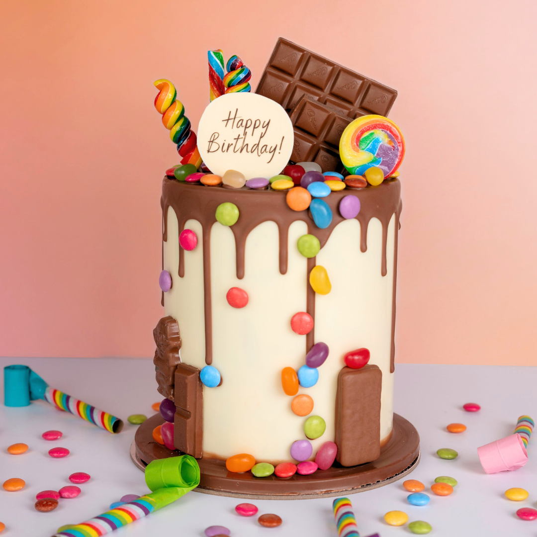 Chocolate smash cake with lolly decoration.